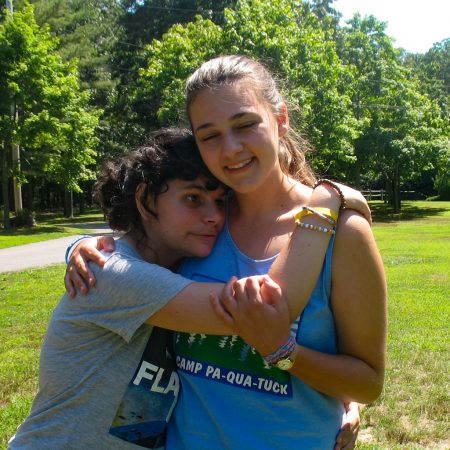 camper hugging counselor